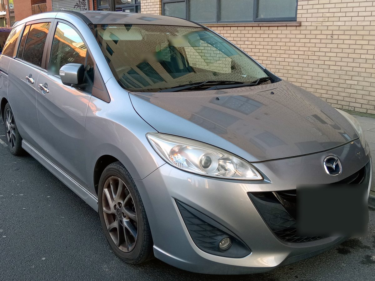 Example photo: silver Mazda Premacy, front three-quarter view. Not the actual car.